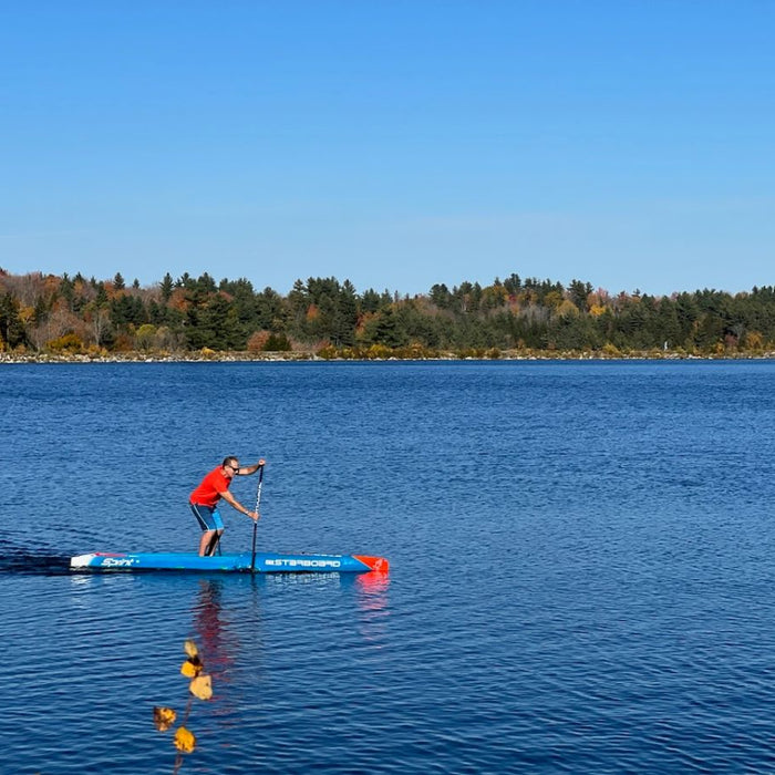 coach jonathan paddleboarding in vermont